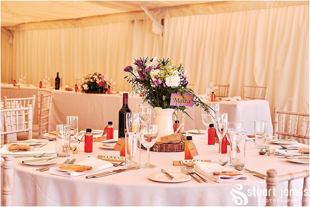 Details of the wedding decor in the marquee for the wedding breakfast at Heath House in Tean by Heath House Wedding Photographers Stuart James
