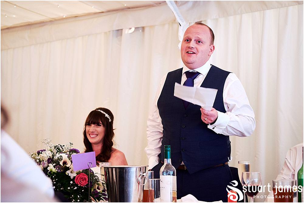 Capturing the Grooms speech and the reactions of the guests at Heath House in Tean by Heath House Wedding Photographers Stuart James