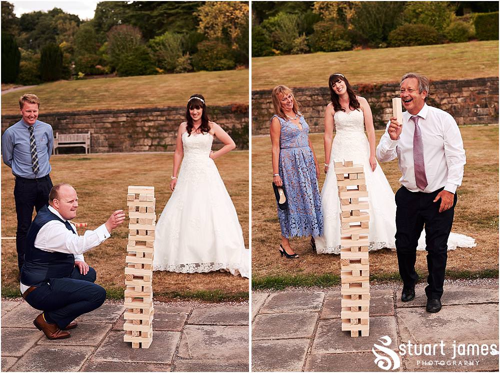Garden games fun in the grounds at Heath House in Tean by Heath House Wedding Photographers Stuart James