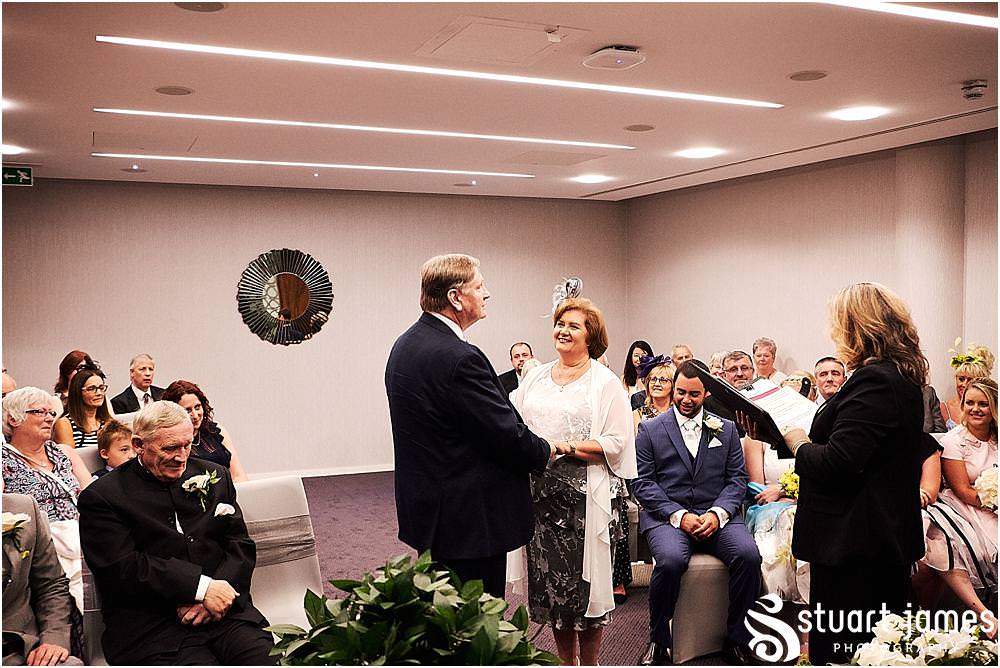 Unobtrusive storytelling photography of the wedding ceremony at Stafford Registry Office in Stafford by Stafford Registry Office Wedding Photographers Stuart James