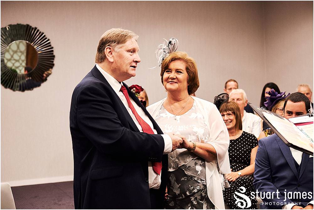 Unobtrusive storytelling photography of the wedding ceremony at Stafford Registry Office in Stafford by Stafford Registry Office Wedding Photographers Stuart James