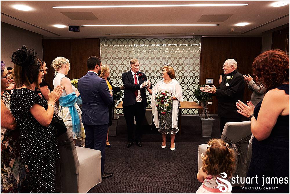Unobtrusive storytelling photography of the wedding ceremony at Stafford Registry Office in Stafford by Stafford Registry Office Wedding Photographers Stuart James