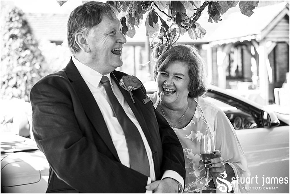 Capturing the reactions of the guests to the close up magician at The Moat House in Stafford - Stafford Registry Office Wedding Photographers Stuart James