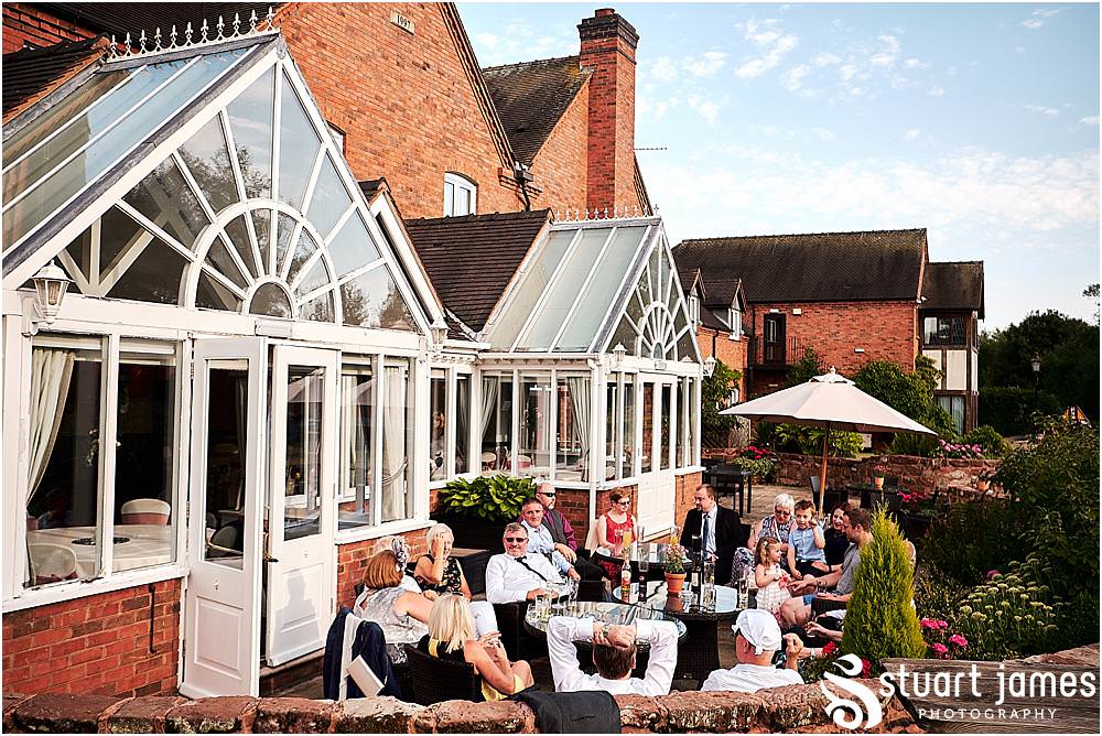 Relaxed evening photographs as the guests enjoy the wedding reception at The Moat House in Stafford - Stafford Registry Office Wedding Photographers Stuart James
