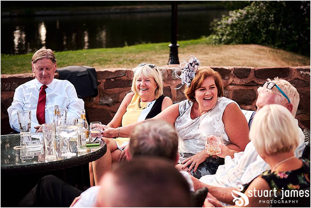 Relaxed evening photographs as the guests enjoy the wedding reception at The Moat House in Stafford - Stafford Registry Office Wedding Photographers Stuart James