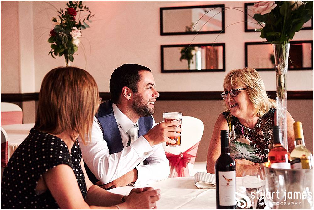 Relaxed evening photographs as the guests enjoy the wedding reception at The Moat House in Stafford - Stafford Registry Office Wedding Photographers Stuart James