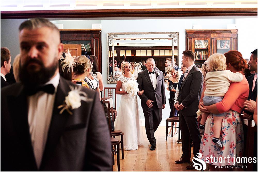 Such incredible moments to capture as the bride walks in to the ceremony with her father at Pendrell Hall in Codsall Wood by Staffordshire Recommended Wedding Photographer Stuart James