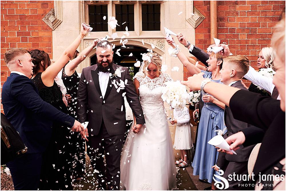 I love a fabulous confetti exit at Pendrell Hall in Codsall Wood by Staffordshire Recommended Wedding Photographer Stuart James