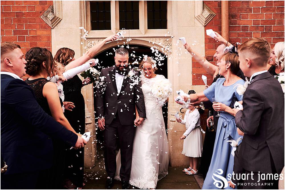I love a fabulous confetti exit at Pendrell Hall in Codsall Wood by Staffordshire Recommended Wedding Photographer Stuart James