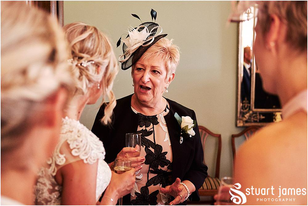 Creative candid photos of the guests enjoying the wedding reception at Pendrell Hall in Codsall Wood by Staffordshire Recommended Wedding Photographer Stuart James