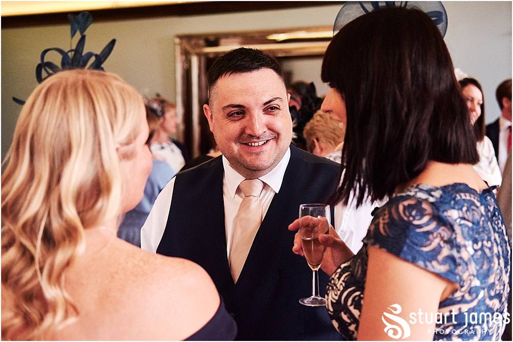Creative candid photos of the guests enjoying the wedding reception at Pendrell Hall in Codsall Wood by Staffordshire Recommended Wedding Photographer Stuart James