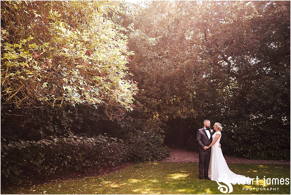 Creative portraits of the bride and groom around the beautiful gardens at Pendrell Hall in Codsall Wood by Staffordshire Recommended Wedding Photographer Stuart James
