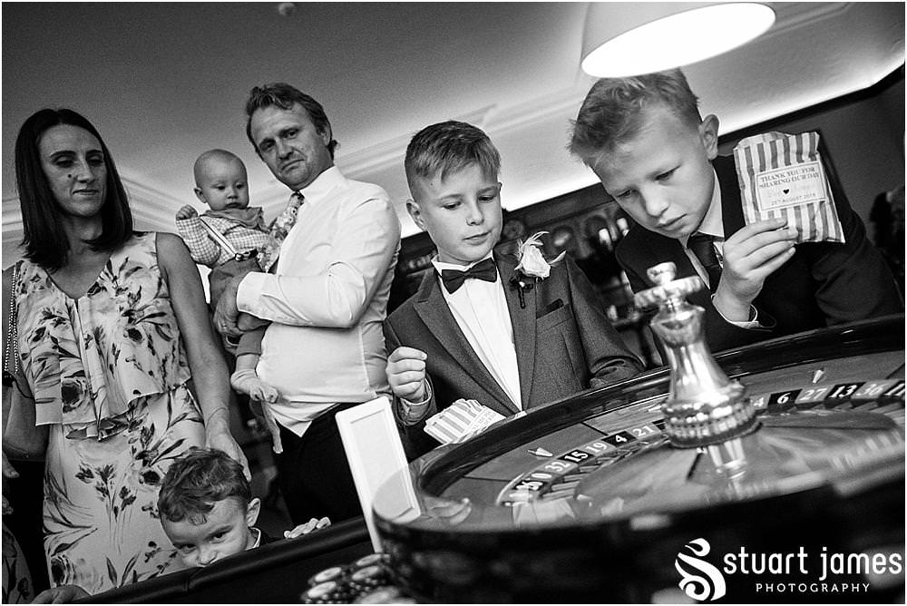 From relaxing in the gardens to enjoying the drinks, the guests were up for a great party at Pendrell Hall in Codsall Wood by Staffordshire Recommended Wedding Photographer Stuart James