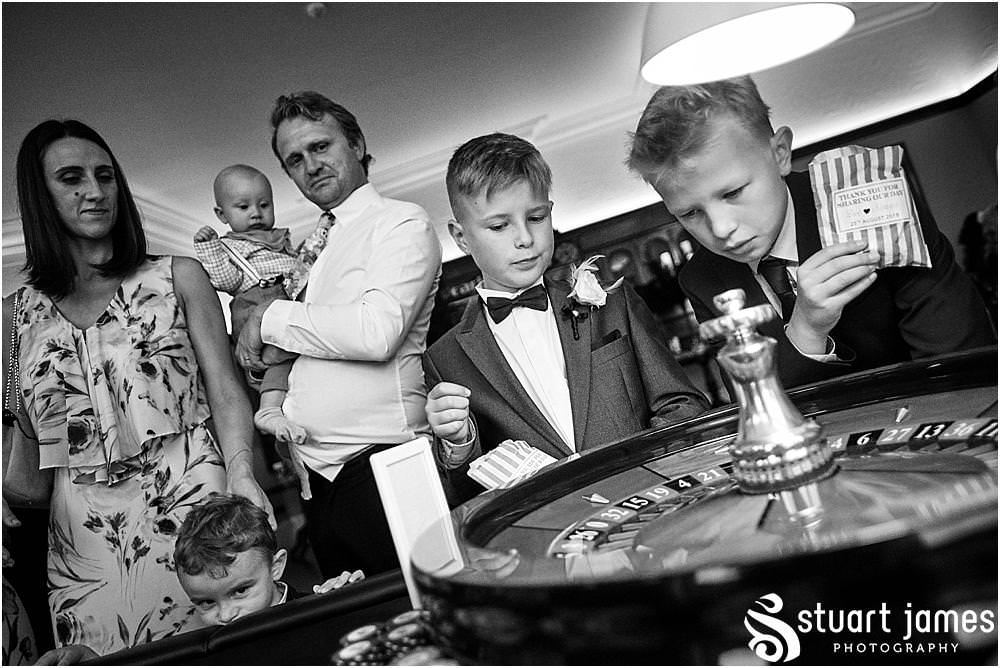From relaxing in the gardens to enjoying the drinks, the guests were up for a great party at Pendrell Hall in Codsall Wood by Staffordshire Recommended Wedding Photographer Stuart James