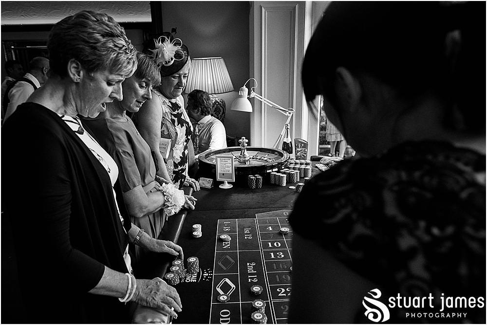 The casino from Royale Casinos was a great addition and filled the evening reception fabulously at Pendrell Hall in Codsall Wood by Staffordshire Recommended Wedding Photographer Stuart James
