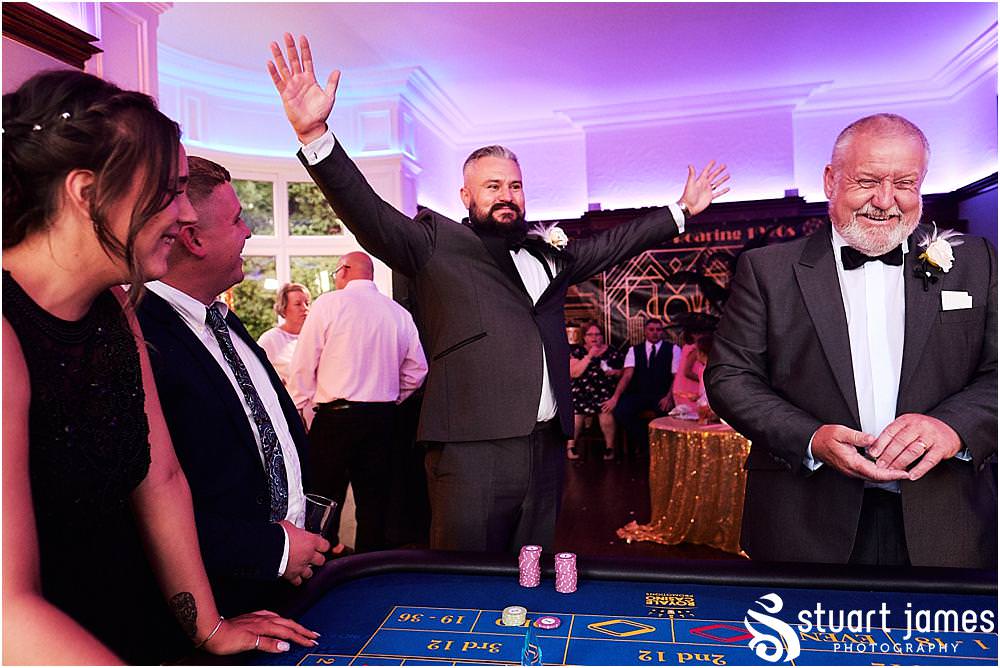 The casino from Royale Casinos was a great addition and filled the evening reception fabulously at Pendrell Hall in Codsall Wood by Staffordshire Recommended Wedding Photographer Stuart James
