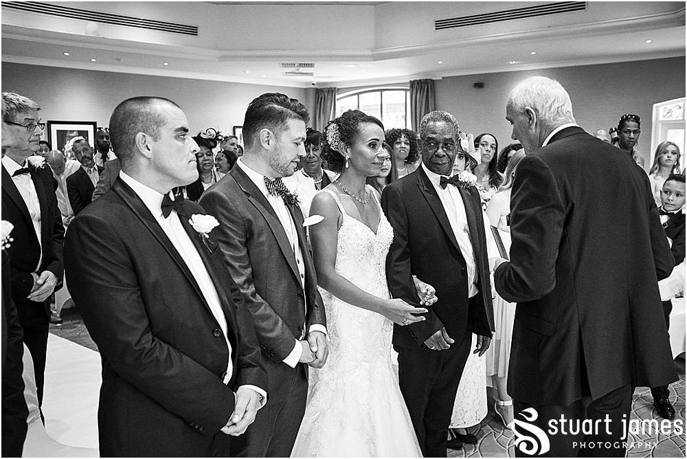 So much emotion during the procession into the wedding ceremony at The Belfry in Sutton Coldfield - Belfry Wedding Photography by Docuemntary Wedding Photographer Stuart James