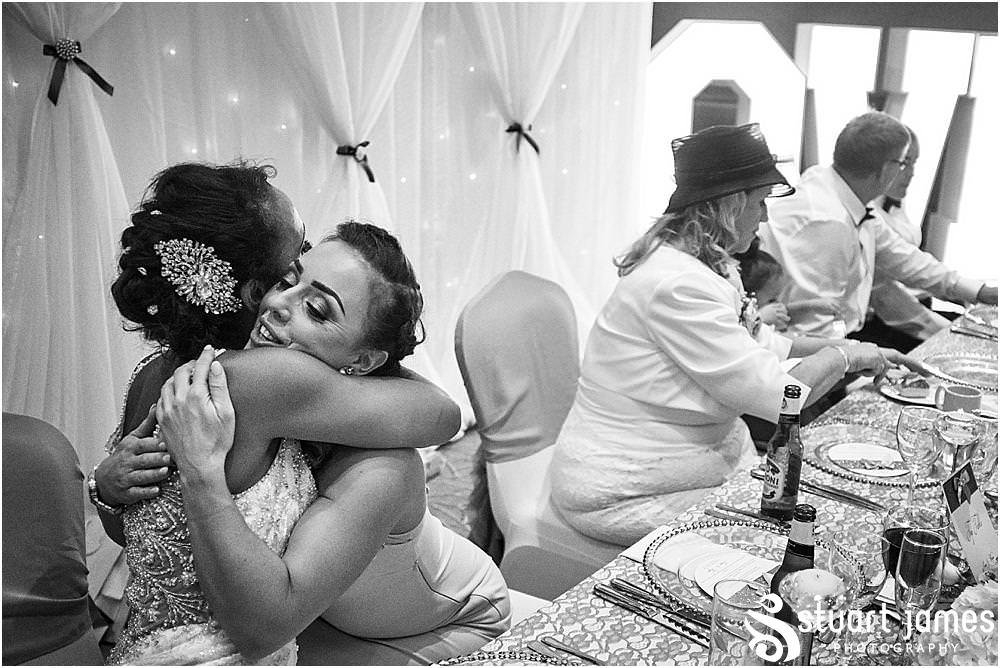 Creative candid photographs as the guests enjoy the wedding breakfast at The Belfry in Sutton Coldfield - Belfry Wedding Photography by Docuemntary Wedding Photographer Stuart James