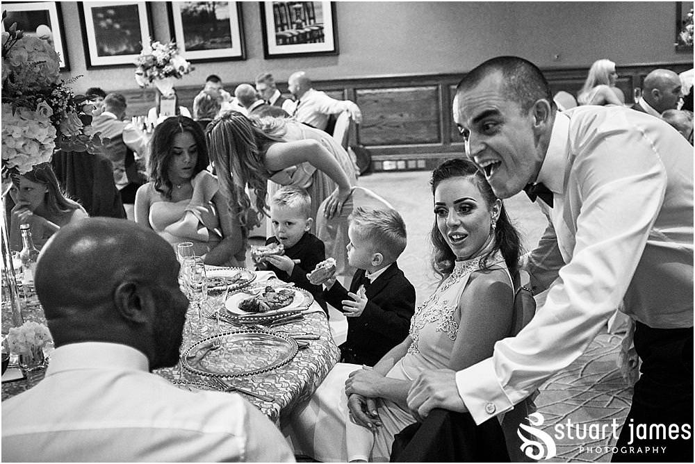 Creative candid photographs as the guests enjoy the wedding breakfast at The Belfry in Sutton Coldfield - Belfry Wedding Photography by Docuemntary Wedding Photographer Stuart James