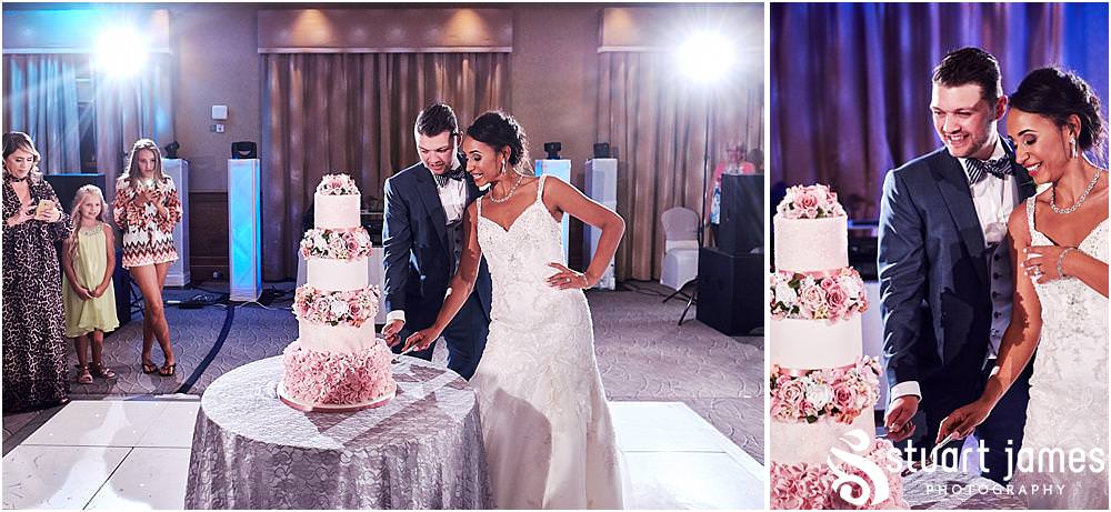 Cake cutting fun at The Belfry in Sutton Coldfield - Belfry Wedding Photography by Docuemntary Wedding Photographer Stuart James
