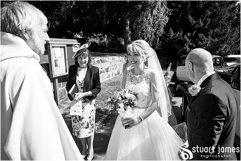Such an exciting time for the bridal party just ahead of the ceremony at St Nicholas Church in Codsall by Documentary Wedding Photographer Stuart James