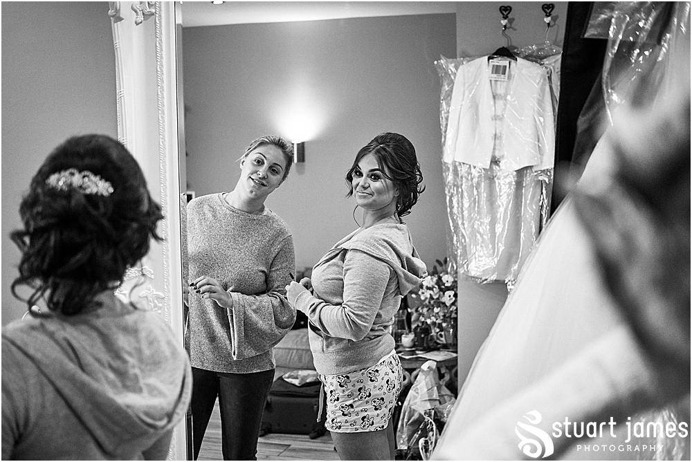 Bride looking at her hair and make up in a full length mirror, photo by Stuart James Photography at Aston Marina, Stone