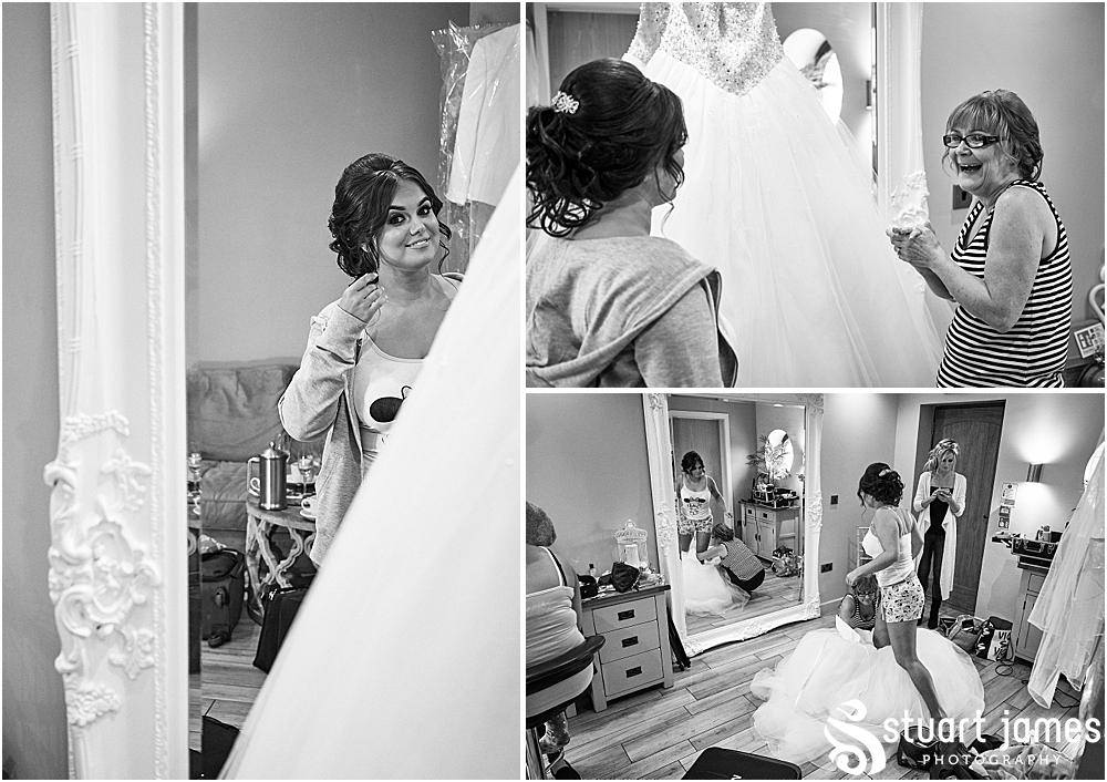 Staffordshire bride and mother of the bride looking at wedding dress from Lucy Alexander Bridal, photo by Stuart James Photography at Aston Marina, Stone