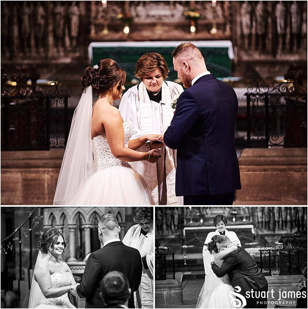 Bride and Groom stand at the altar and exchange rings and embrace, photo by Stuart James Photography at Holy Trinity, Eccleshall