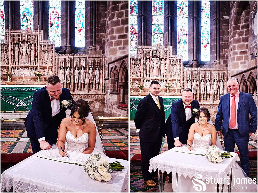 Bride, Groom sign wedding register with Witnesses, photo by Stuart James Photography at Holy Trinity, Eccleshall