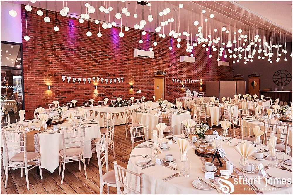 Rustic wedding reception at Aston Marina decorated with hessian and white tables cloths, red and white roses and fair lights, photo by Stuart James Photography at Aston Marina, Stone.