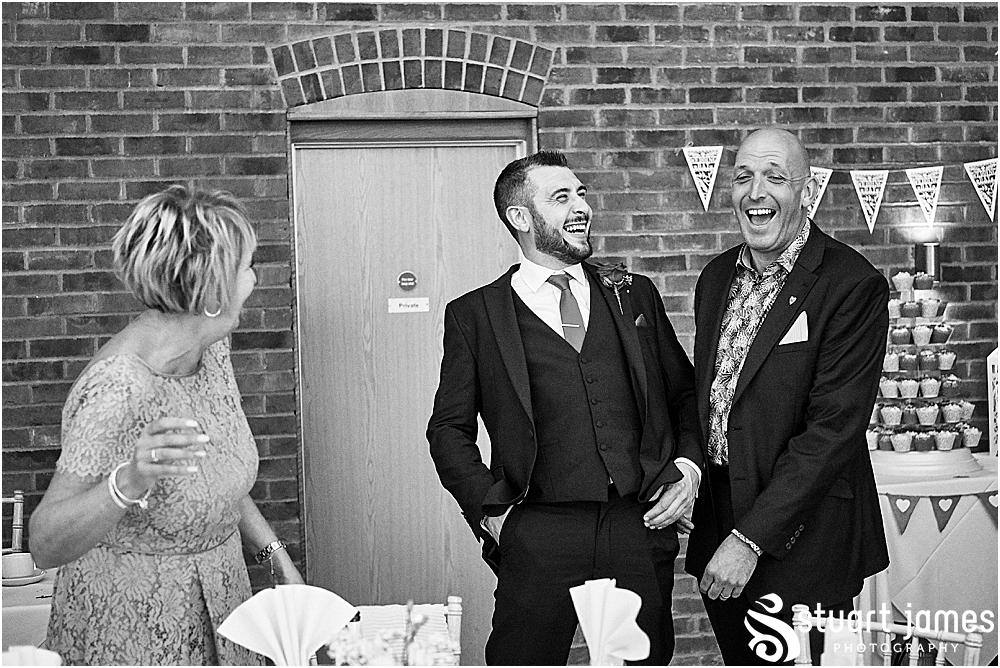 Wedding guests talk and laugh, photo by Stuart James Photography at Aston Marina, Stone.
