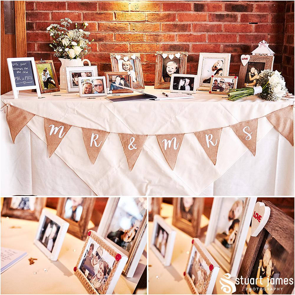 Rustic photographs table with guest book and bridal bouquet, decorated with hessian mr & mrs bunting, photo by Stuart James Photography at Aston Marina, Stone.