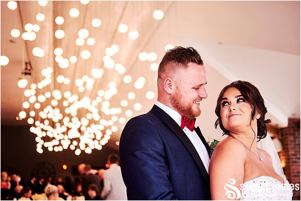 Bride and Groom pose for wedding photograph at wedding reception under fairy lights, photo by Stuart James Photography at Aston Marina, Stone.