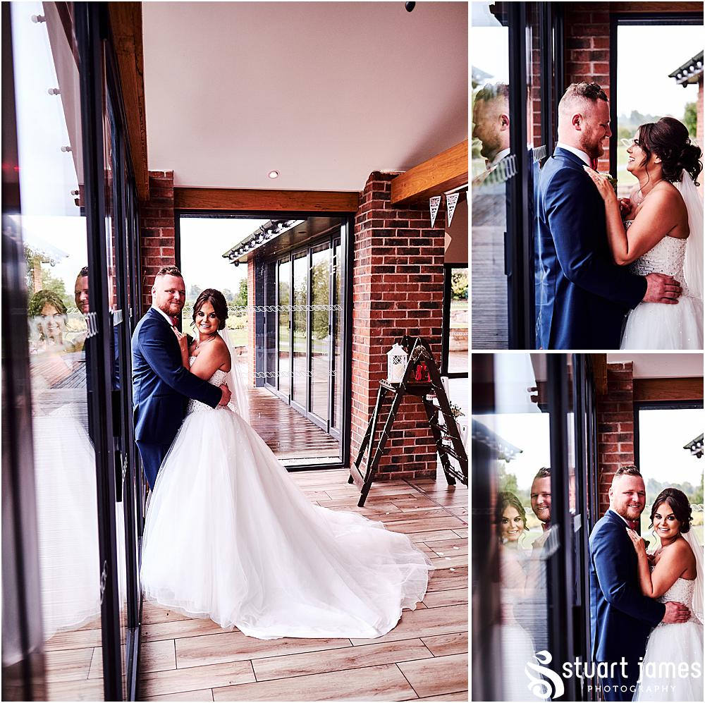 Bride and Groom embrace for indoor wedding portrait photograph, photo by Stuart James Photography at Aston Marina, Stone.