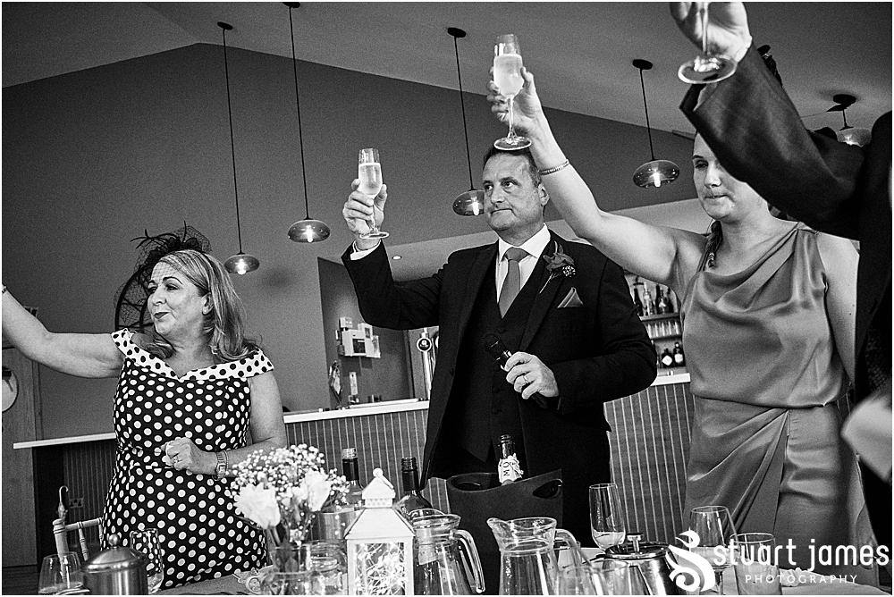 Wedding guests make toast to Bride and Groom, photo by Stuart James Photography at Aston Marina, Stone.