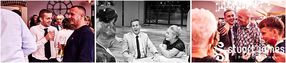 Wedding guests having drinks and talking within the reception room at Aston Marina, photo by Stuart James Photography at Aston Marina, Stone