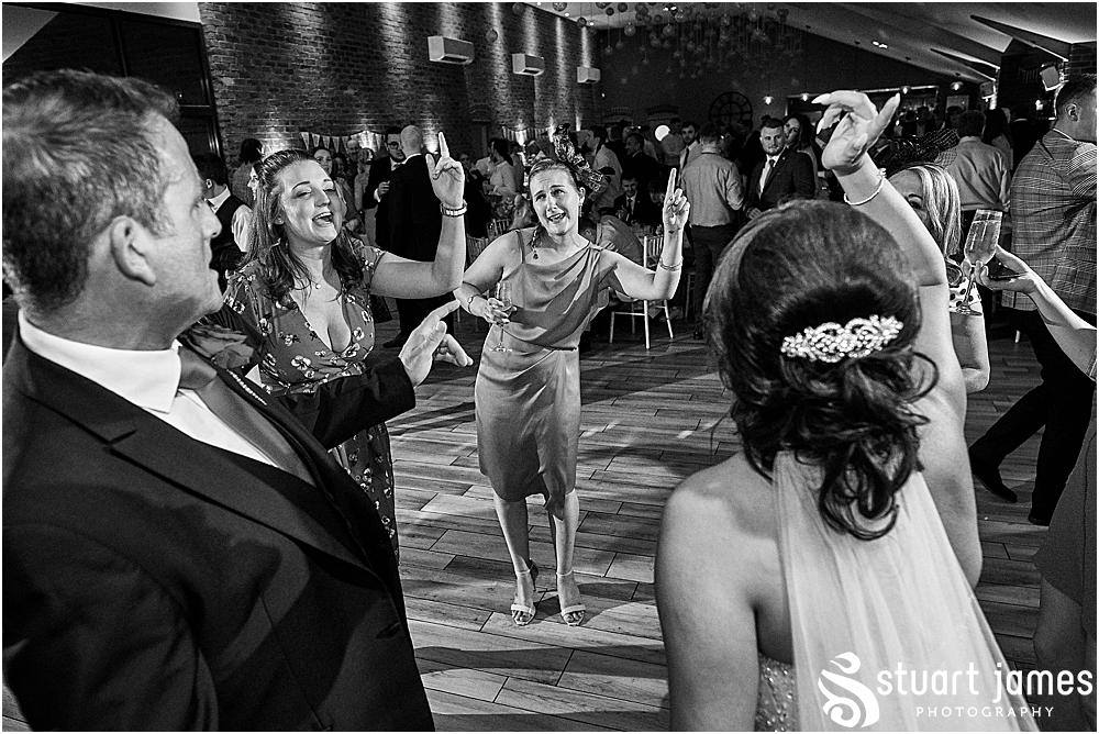 Wedding guests dance with the bride on the dance floor, photo by Stuart James Photography at Aston Marina, Stone