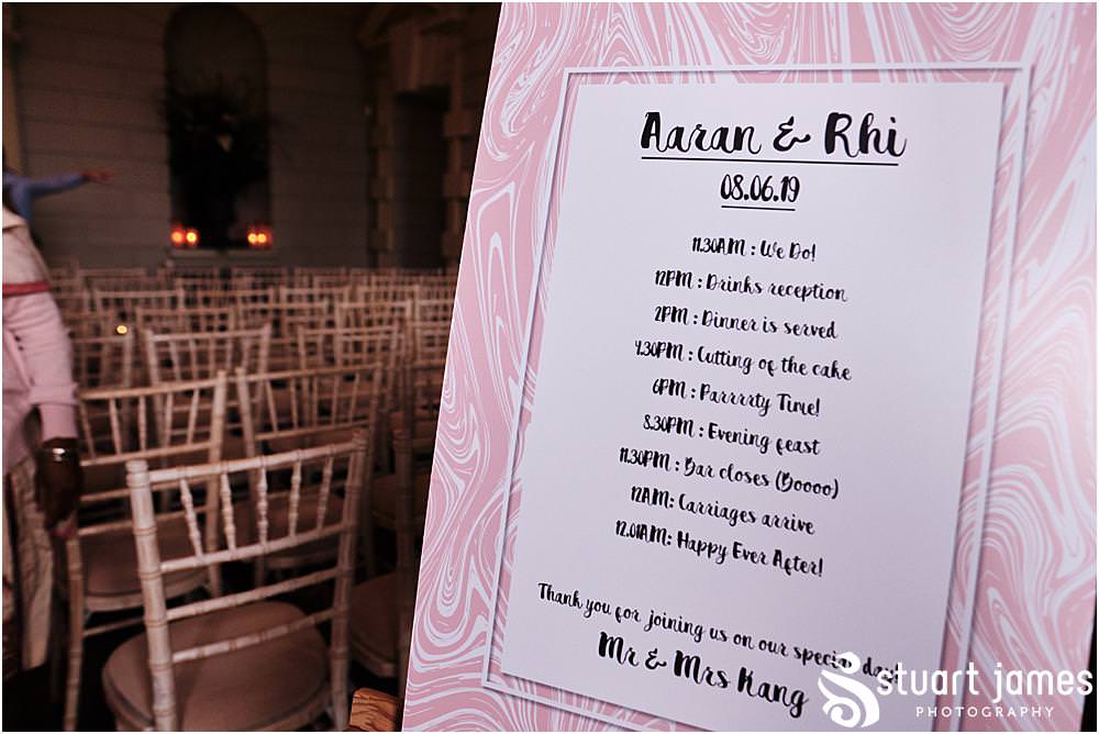 Pink Order of the day wedding sign in ceremony room at Davenport House in Shropshire by Davenport House Wedding Photographers Stuart James