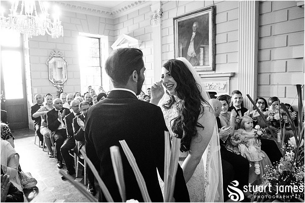 Bride cries and wipes tear away at Davenport House in Shropshire by Davenport House Wedding Photographers Stuart James