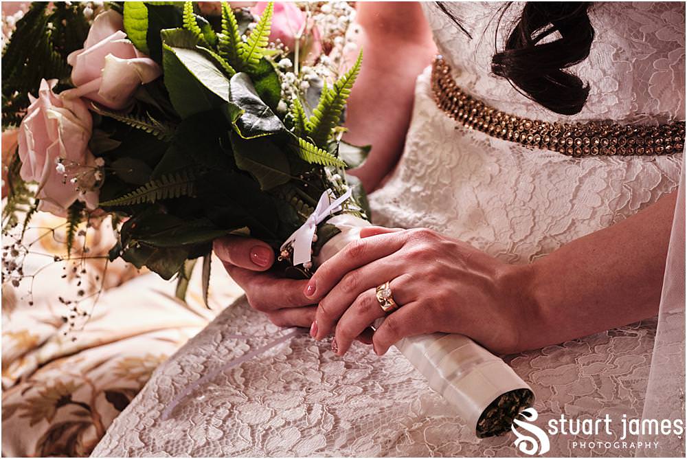 Bride hold wedding bouquet with pink painted nails and gold wedding and engagement ring at Davenport House in Shropshire by Davenport House Wedding Photographers Stuart James