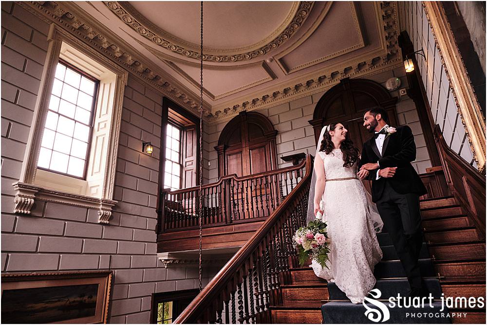 Bride and Groom walk down stairs arm in arm at Davenport House in Shropshire by Davenport House Wedding Photographers Stuart James at Davenport House in Shropshire by Davenport House Wedding Photographers Stuart James