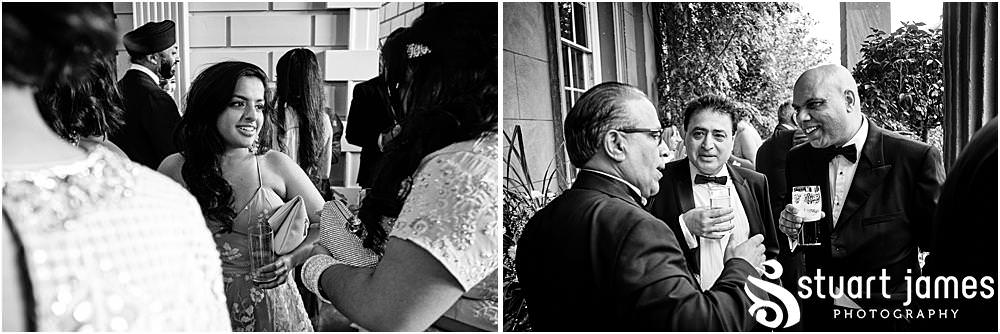 Wedding Guests talk at Davenport House in Shropshire by Davenport House Wedding Photographers Stuart James