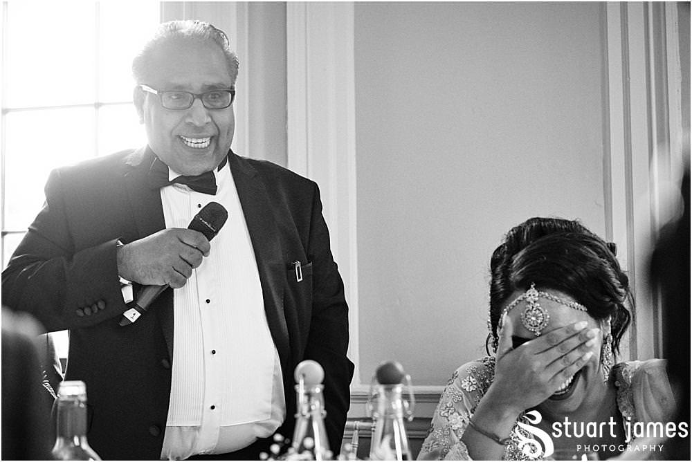 Father of the Groom starts making speech with microphone at Davenport House in Shropshire by Davenport House Wedding Photographers Stuart James