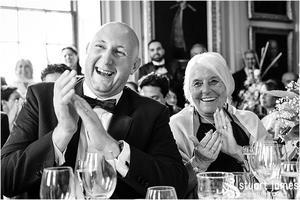 Wedding guests applaud the Father of The Groom after speech at Davenport House in Shropshire by Davenport House Wedding Photographers Stuart James