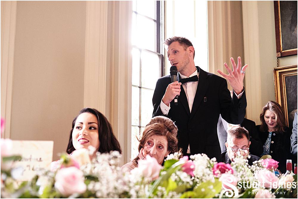 Gooms man saying his speech to bride and groom and wedding guests at Davenport House in Shropshire by Davenport House Wedding Photographers Stuart James