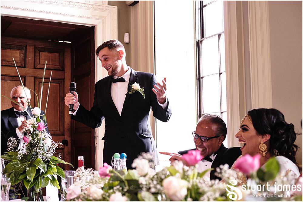 Best man saying his speech to bride and groom and wedding guests at Davenport House in Shropshire by Davenport House Wedding Photographers Stuart James