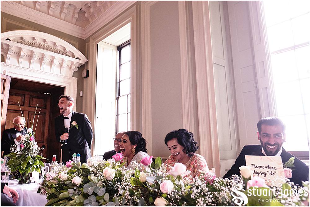 Best man saying his speech to bride and groom and wedding guests at Davenport House in Shropshire by Davenport House Wedding Photographers Stuart James