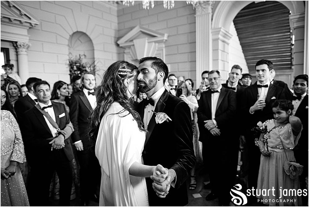 Bride and Groom dance to live music amongst wedding guests at Davenport House in Shropshire by Davenport House Wedding Photographers Stuart James