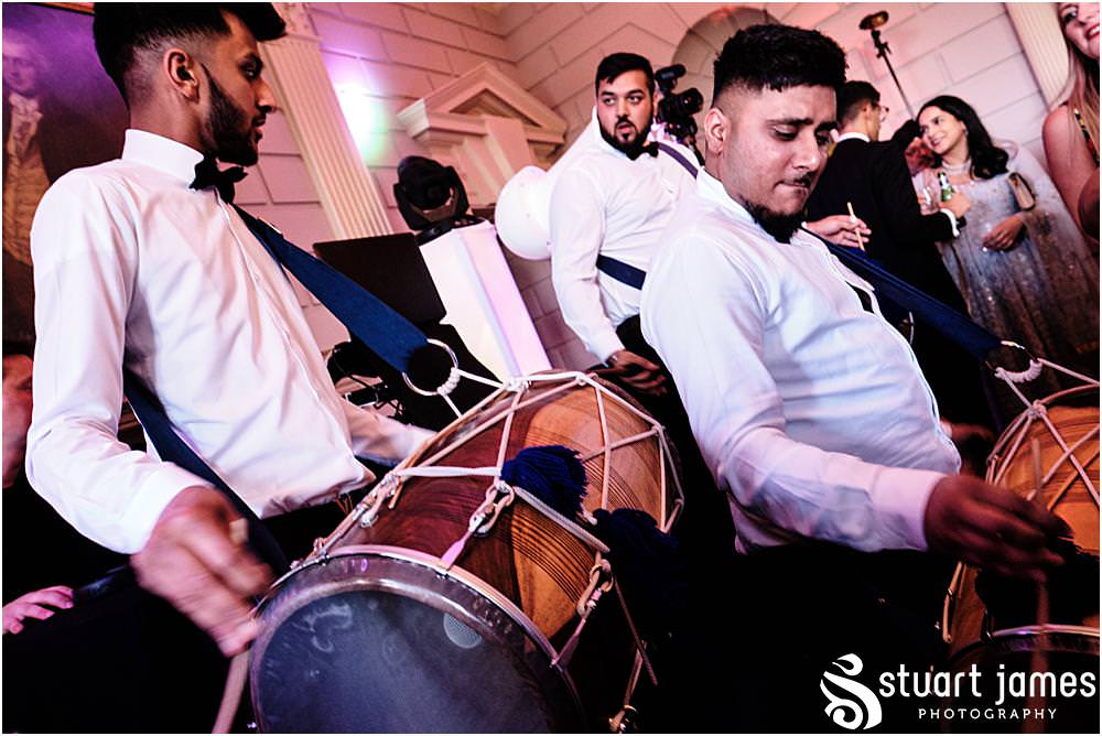 Gentleman playing the drums at Davenport House in Shropshire by Davenport House Wedding Photographers Stuart James