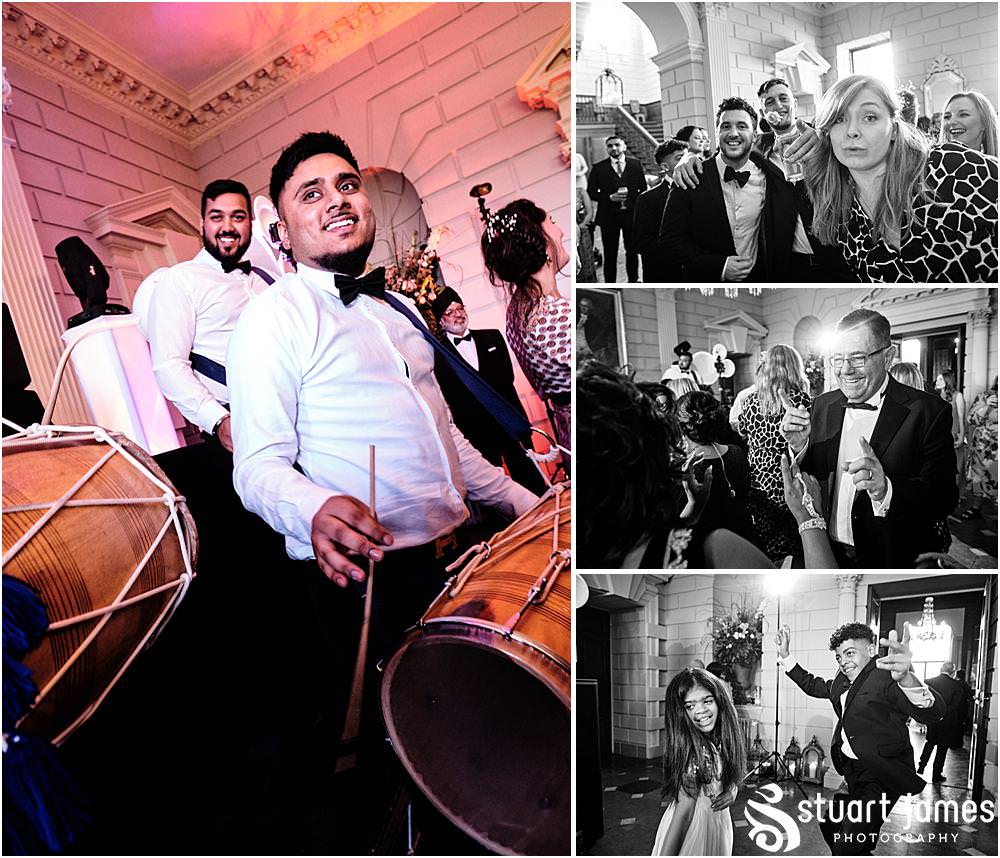 Wedding guests dancing to live music at Davenport House in Shropshire by Davenport House Wedding Photographers Stuart James